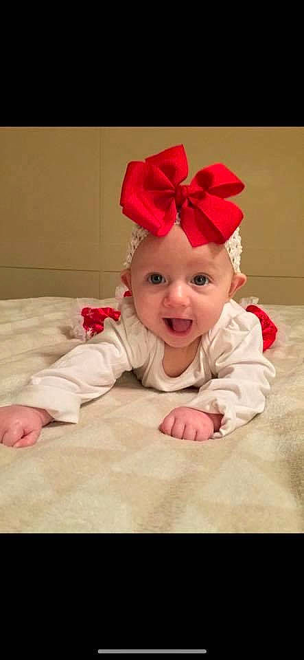 Alexandria joined the competition — help win amazing prizes! baby, baby_toddler_clothing, cheek, child, costume, ear, fashion_accessory, hair_accessory, head, headband, headgear, headwear, person, petal, pink, red, skin, smile, surprise, toddler