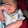 Andrew is registered to the contest to win money with this photo: baby, newborn, sleeping, infant, onesie, face, hand, arm, closeup, portrait, indoor, pillow, blanket, relaxed, peaceful, skin, fingernails, fabric, patterned_clothing, resting