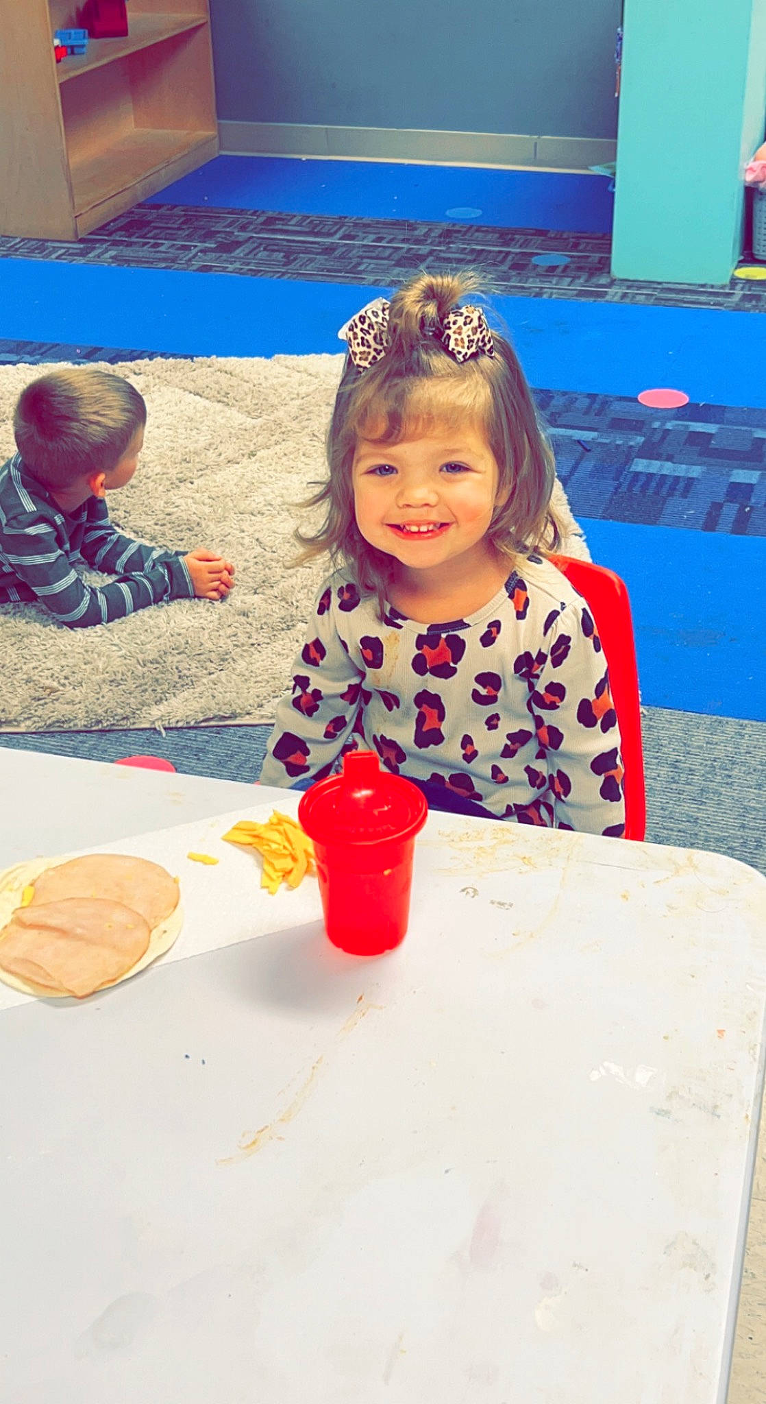 Georgia joined the competition — help win amazing prizes! baby, blue, chair, child, clothing, event, flooring, fun, happy, joy, kindergarten, leisure, person, play, recreation, sand, sharing, sitting, smile, table