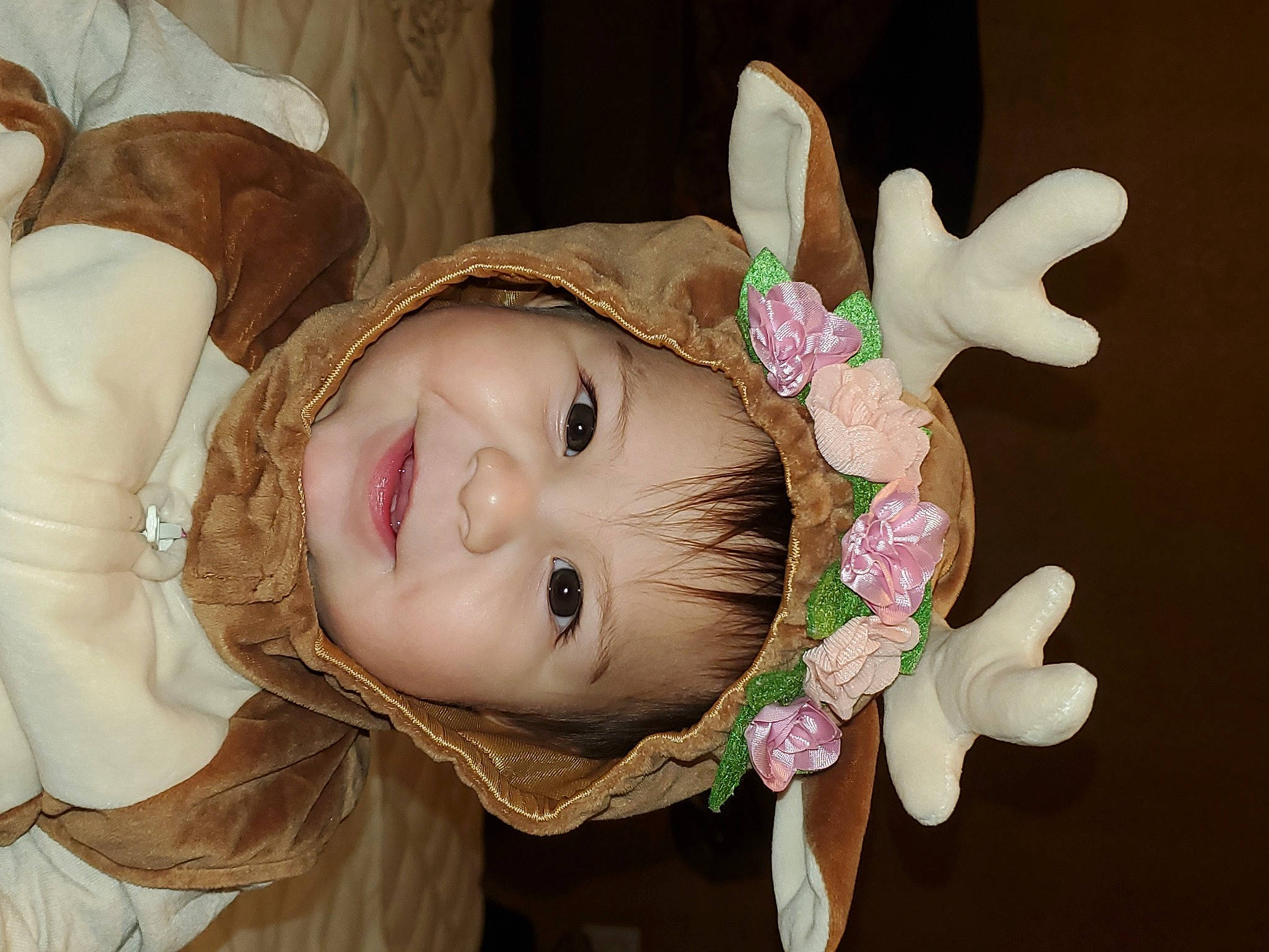 Nylin Sky is registered to the contest to win money with this photo: baby, cheek, chin, ear, eye, eyebrow, eyelash, face, flash_photography, happy, head, headpiece, headwear, human_body, joy, lip, nose, person, petal, pink