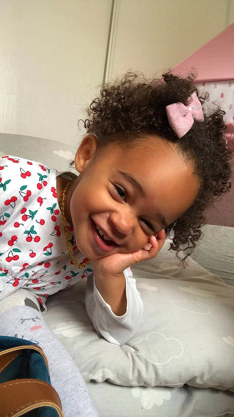 Janelle participe au concours pour gagner de l'argent avec cette photo : baby_toddler_clothing, black_hair, child, chin, comfort, eyebrow, eyelash, flash_photography, forehead, fun, happy, iris, joy, linens, lip, neck, nose, person, shoulder, skin