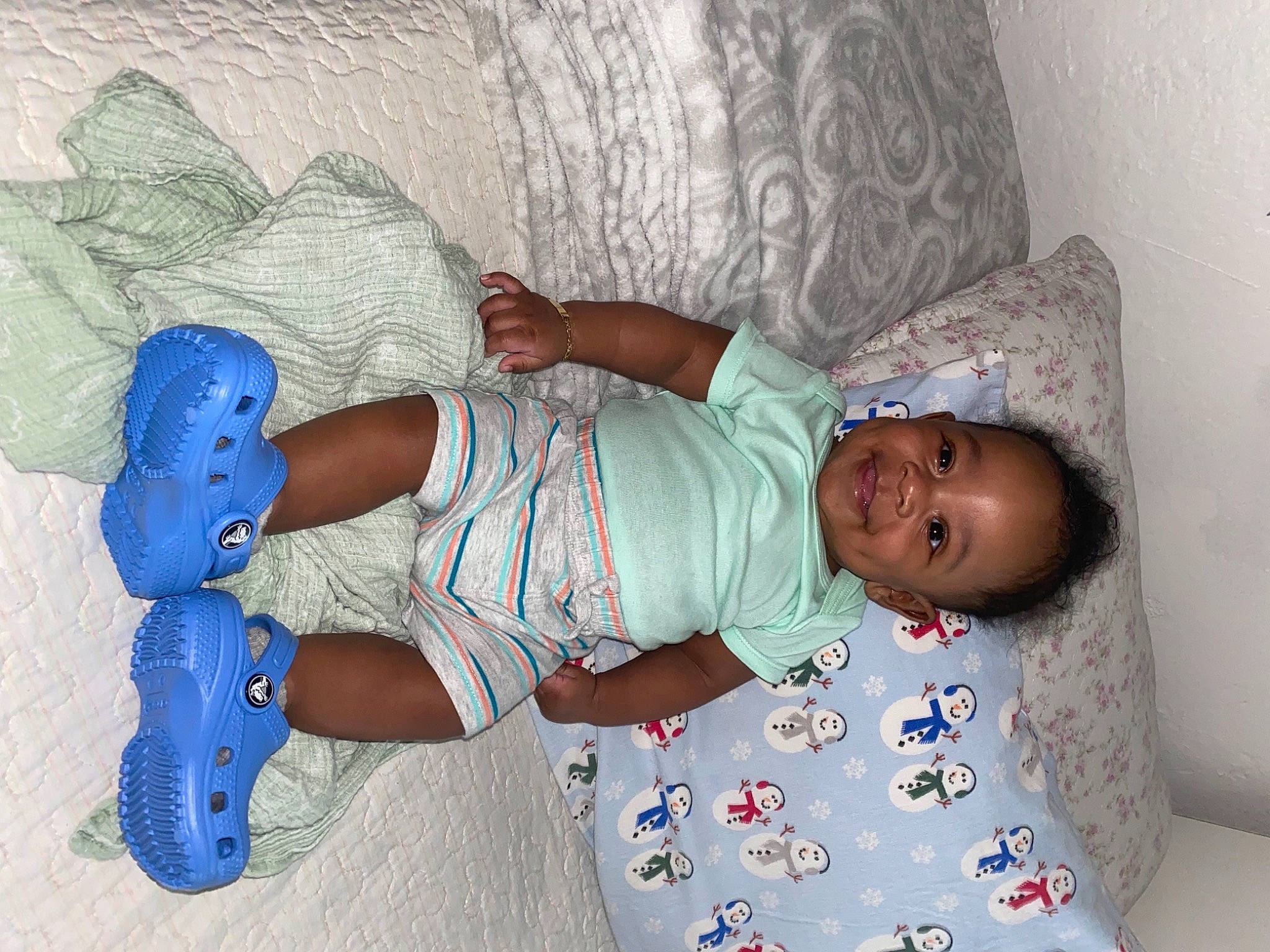 Kamren joined the competition — help win amazing prizes! arm, baby, baby_products, baby_toddler_clothing, child, comfort, electric_blue, human, human_body, human_leg, joint, joy, leg, linens, pattern, person, pink, room, skin, sock