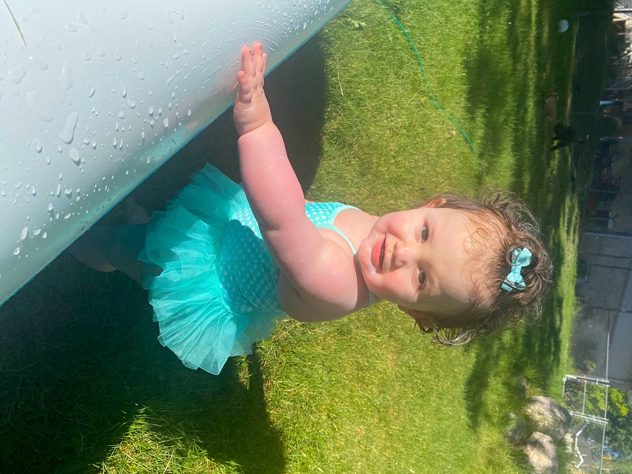Hazel Jo is registered to the contest to win money with this photo: azure, beauty, child, electric_blue, fun, grass, grassland, hairstyle, happy, leaf, leisure, people_in_nature, person, play, recreation, shade, swimwear, toddler, tree, underwater