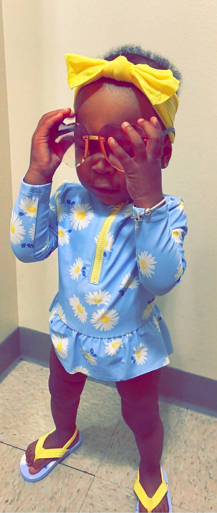 Jalia joined the competition — help win amazing prizes! arm, baby_toddler_clothing, chest, child, electric_blue, eyewear, finger, forehead, gesture, lip, neck, nose, orange, person, personal_protective_equipment, shoulder, sleeve, t_shirt, thumb, toddler