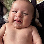 Phenyx joined the competition — help win amazing prizes! baby, blanket, cheeks, child, cozy, cute, expression, eyes, face, hand, happy, indoors, infant, lying_down, mouth, newborn, portrait, skin, smile, soft