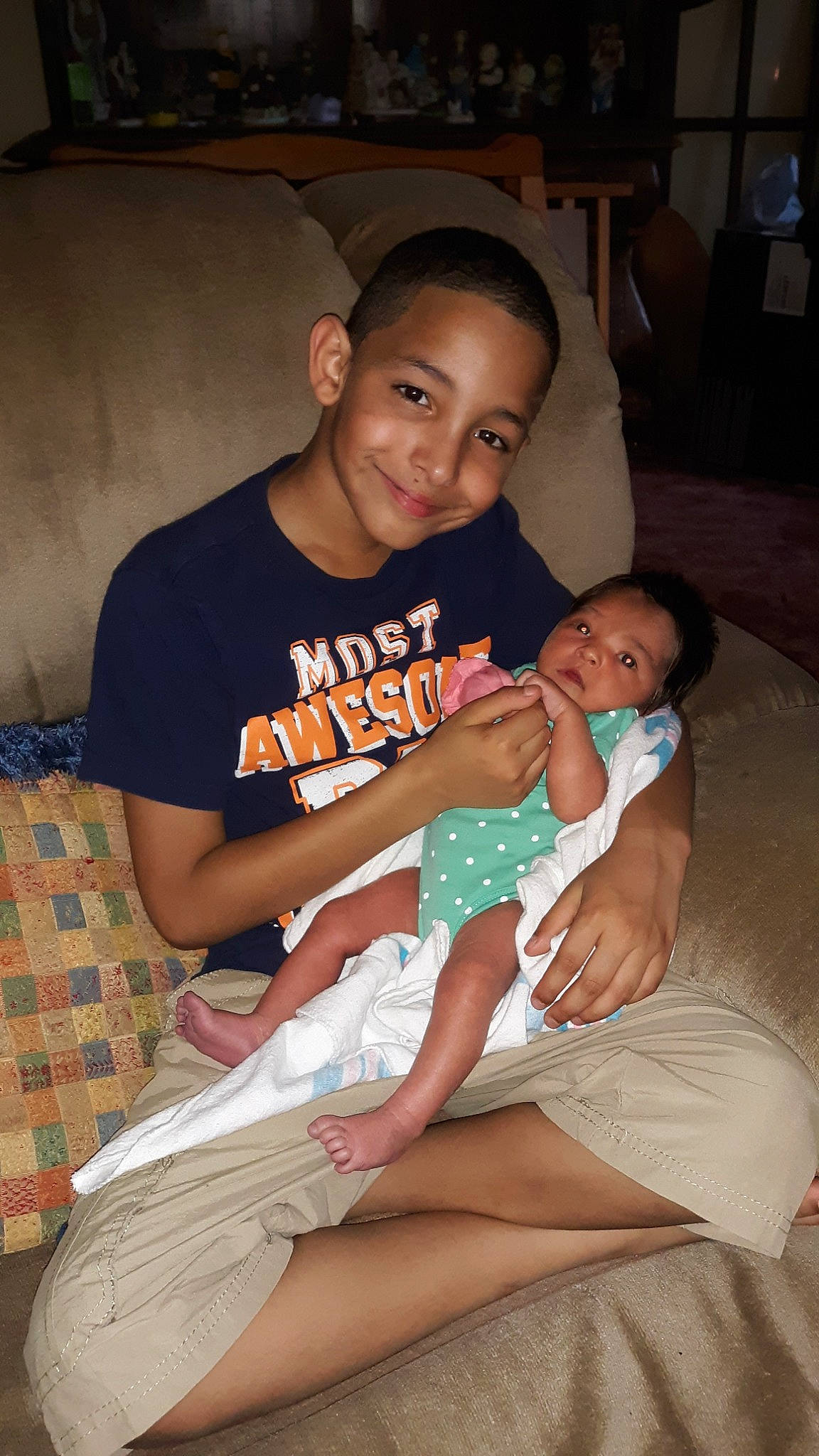 Jayden is registered to the contest to win money with this photo: child, daughter, fun, joy, lap, leg, person, sitting, smile, toddler, vacation