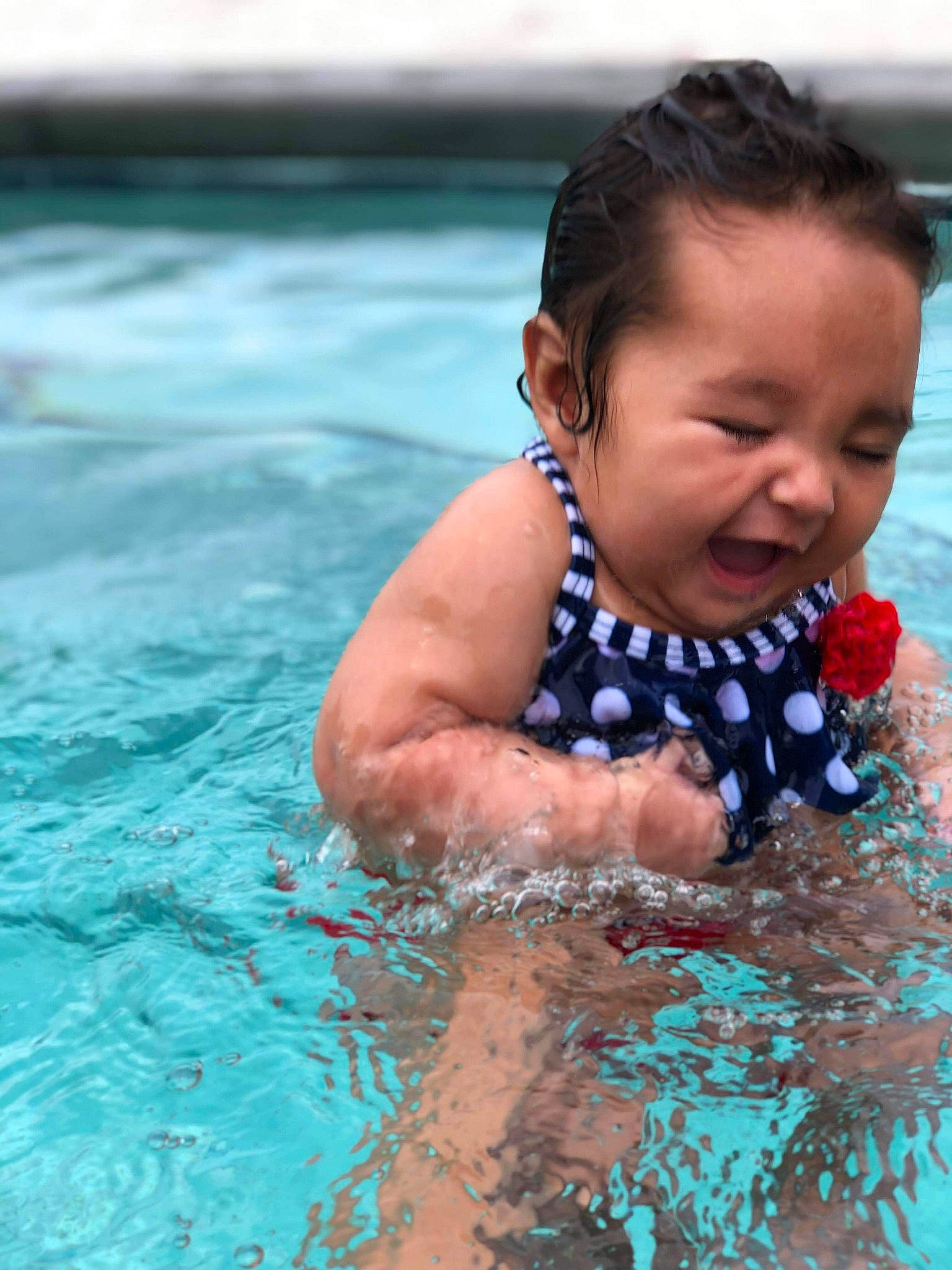 Jazmyn is registered to the contest to win money with this photo: baby, child, fun, happy, head, leisure, person, play, product, recreation, sea, skin, smile, summer, swimming, swimming_pool, swimwear, toddler, vacation, water