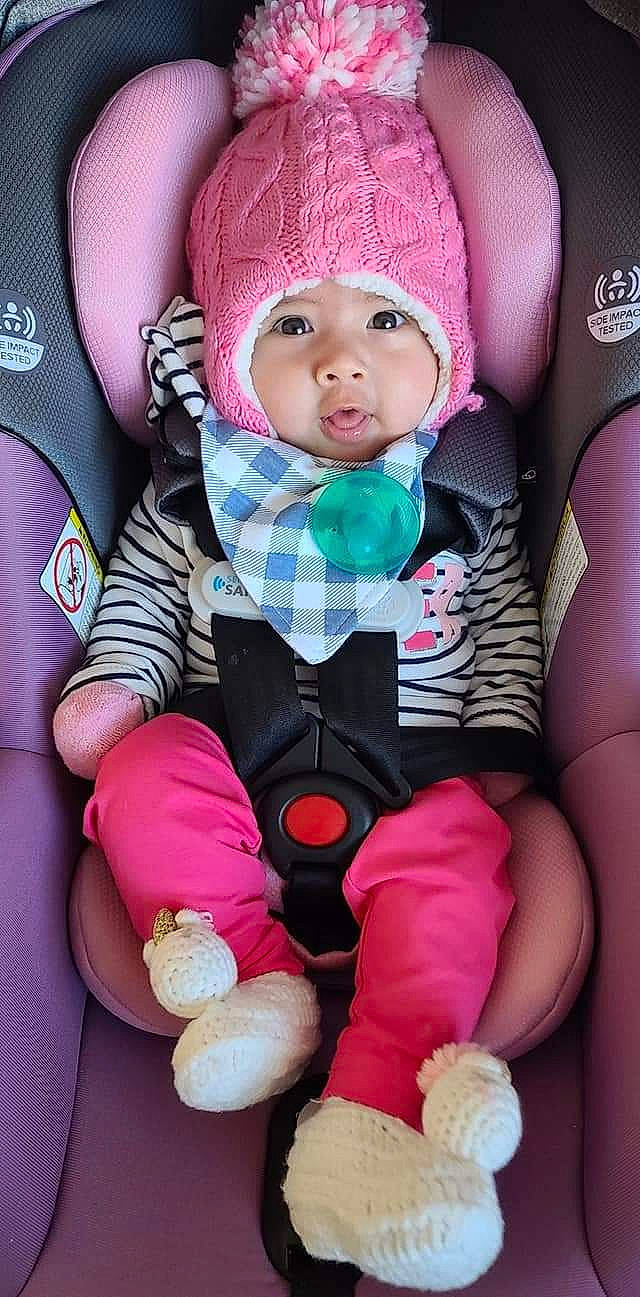 Selina is registered to the contest to win money with this photo: baby, baby_carriage, baby_in_car_seat, baby_products, baby_safety, baby_toddler_clothing, beanie, bonnet, car_seat, cheek, child, comfort, headwear, lap, person, pink, product, seat_belt, stuffed_toy, toddler