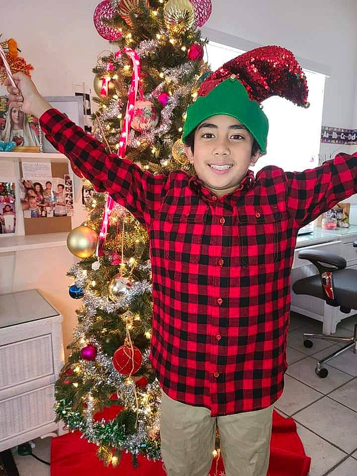 Allen joined the competition — help win amazing prizes! christmas, christmas_decoration, christmas_eve, christmas_ornament, christmas_tree, conifer, costume_accessory, costume_hat, event, headwear, holiday, holiday_ornament, home, interior_design, joy, laugh, ornament, party_supply, person, plaid