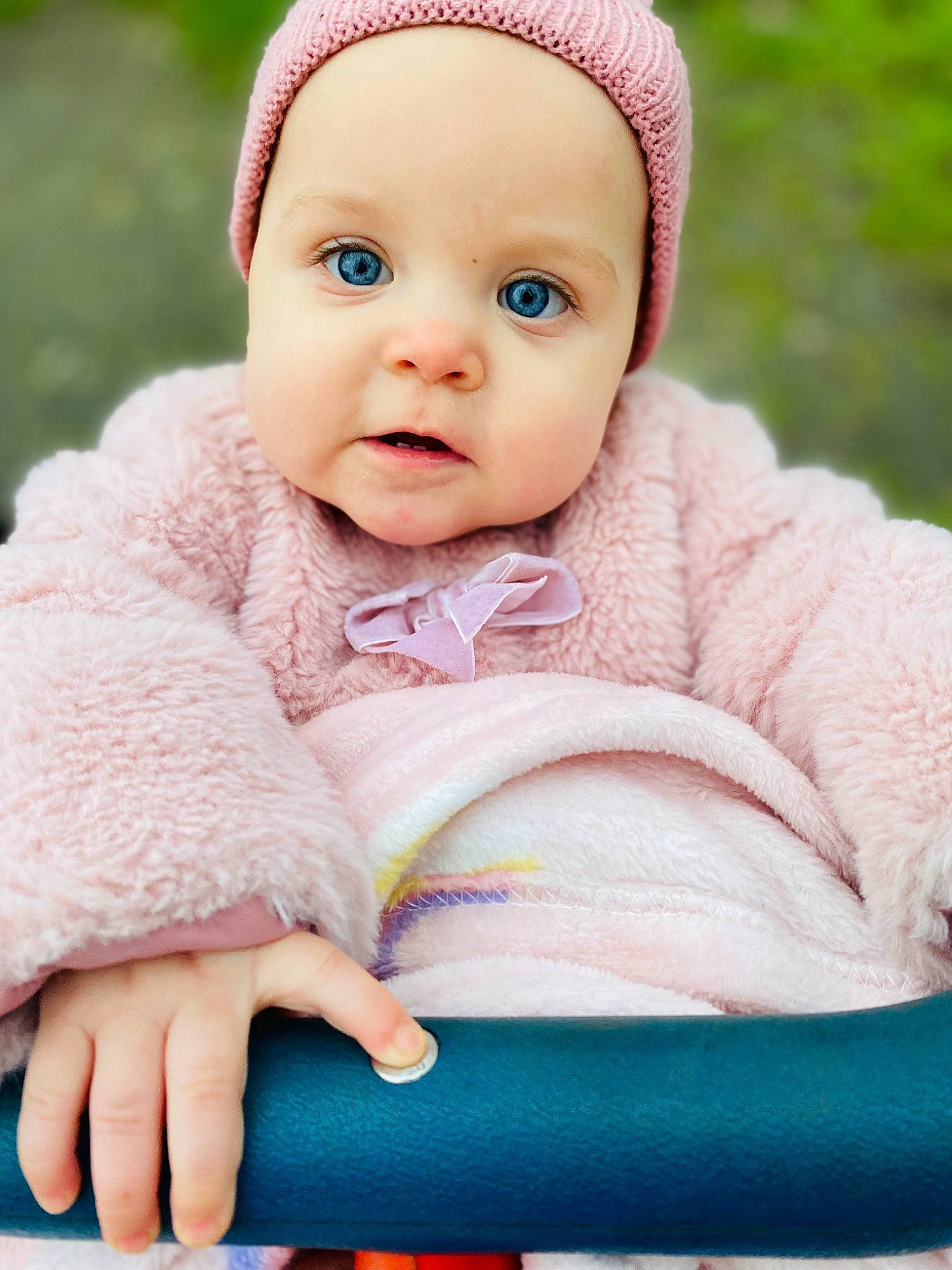 Hayley joined the competition — help win amazing prizes! baby, baby_toddler_clothing, cap, cheek, child, comfort, dress, eye, fashion_accessory, grass, happy, headwear, knit_cap, magenta, outerwear, person, pink, skin, sleeve, textile