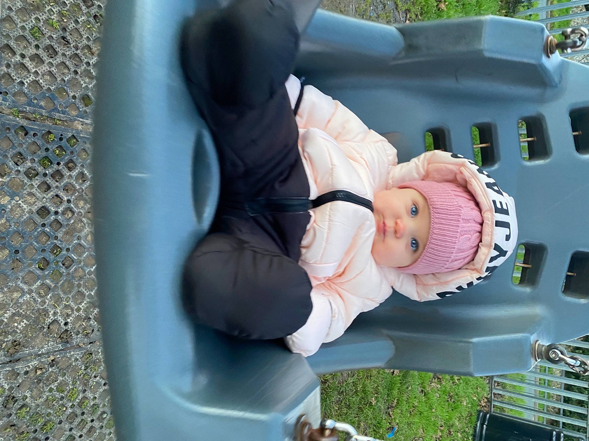 Hayley is registered to the contest to win money with this photo: auto_part, automotive_exterior, automotive_wheel_system, baby, baby_products, baby_toddler_clothing, bumper, child, fun, grass, hat, headwear, lawn_ornament, leisure, motor_vehicle, person, plant, sitting, toddler, tree