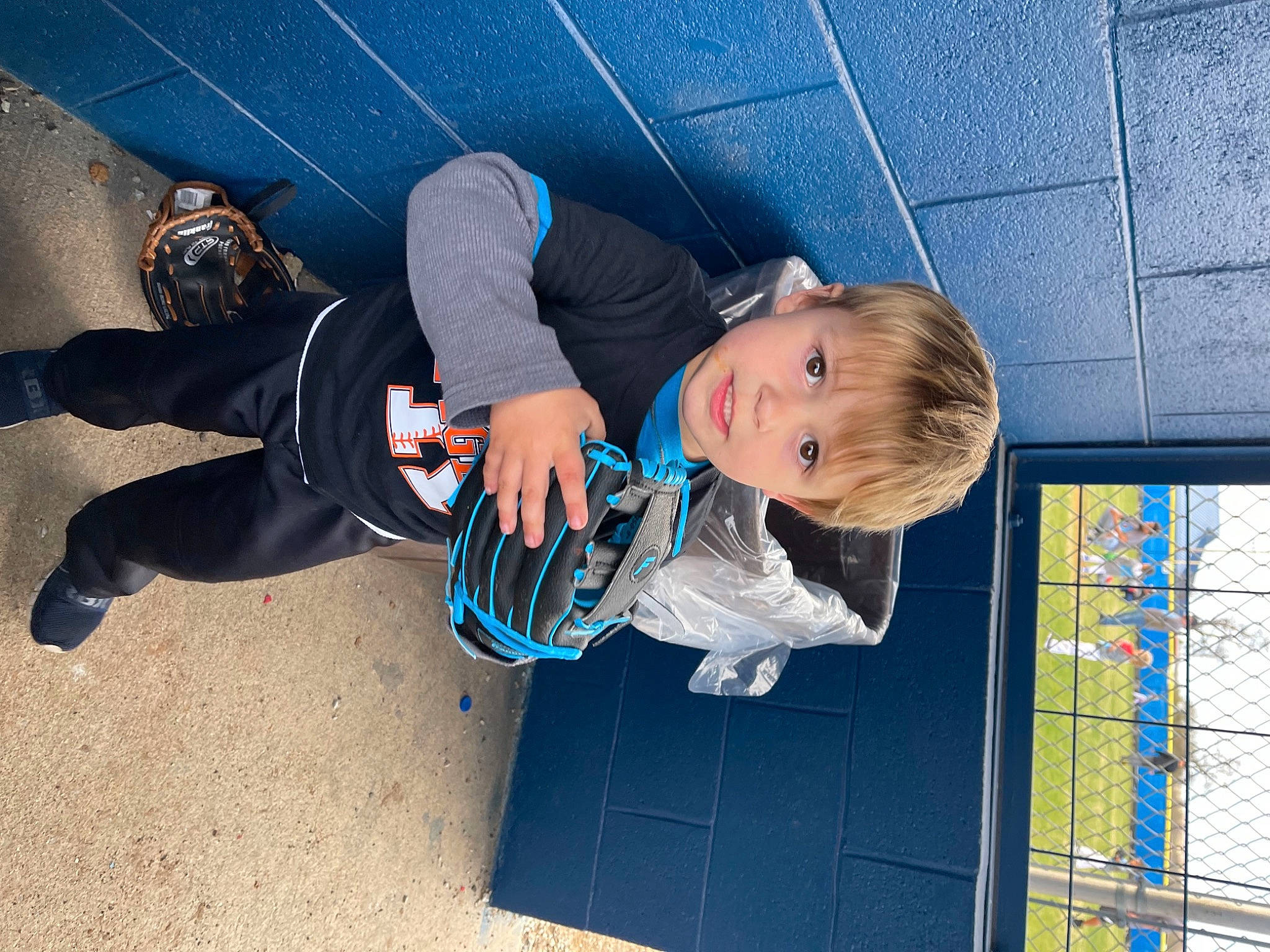 Brantley is registered to the contest to win money with this photo: azure, blue, child, concrete, denim, electric_blue, fun, knee, leisure, person, plant, recreation, rope, shadow, sneakers, space, t_shirt, toddler, tree, walking_shoe