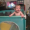 Charlie joined the competition — help win amazing prizes! baby, child, playpen, indoor, smiling, toy_story, television, furniture, home, carpet, toy, person, shirtless, curly_hair, door, suitcase, shelf, floor, happy, living_room