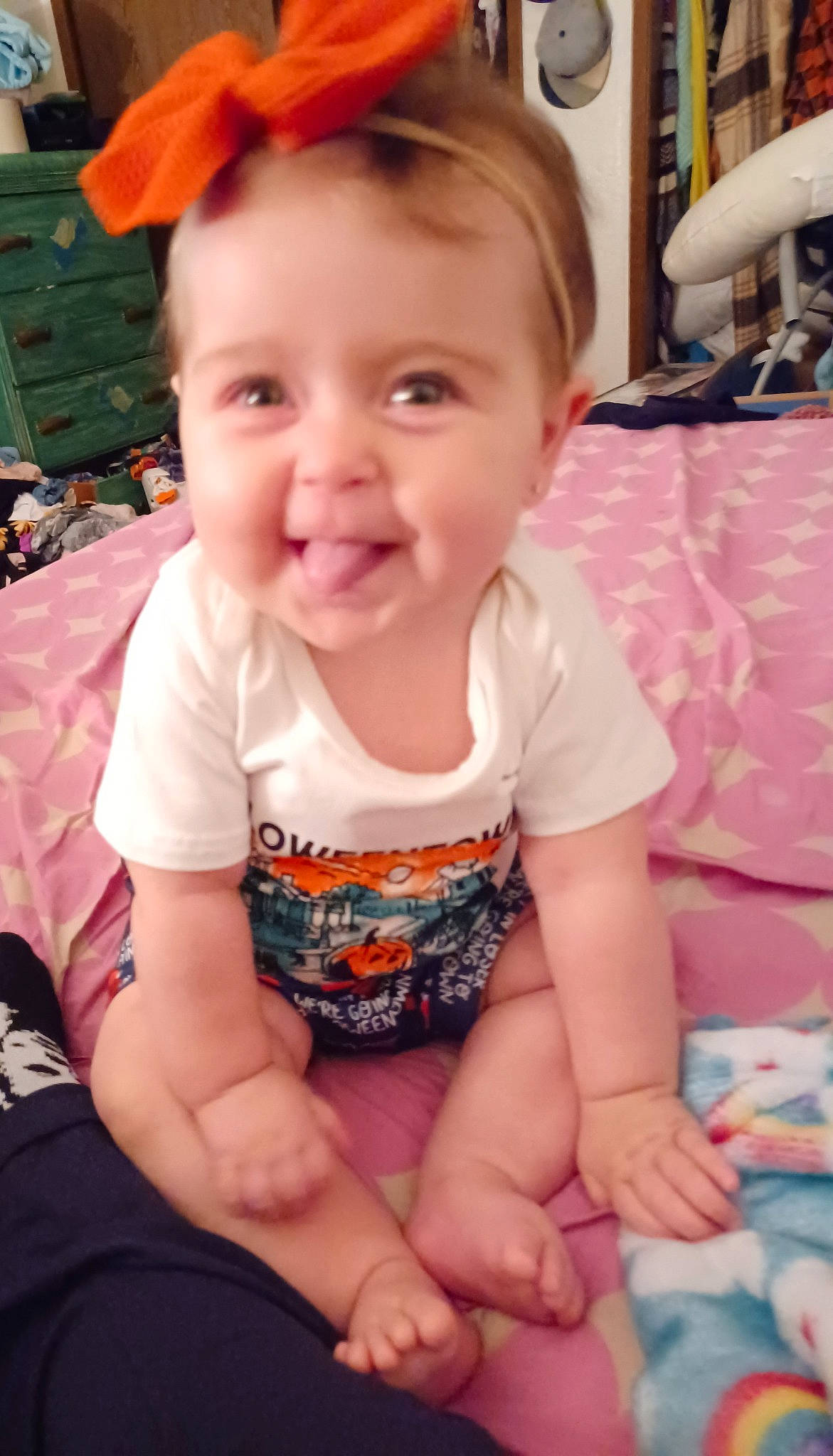 Kaylynn is registered to the contest to win money with this photo: baby, baby_toddler_clothing, cheek, child, eye, finger, fun, hairstyle, happy, head, human_leg, knee, mouth, person, pink, skin, sleeve, smile, thigh, toddler