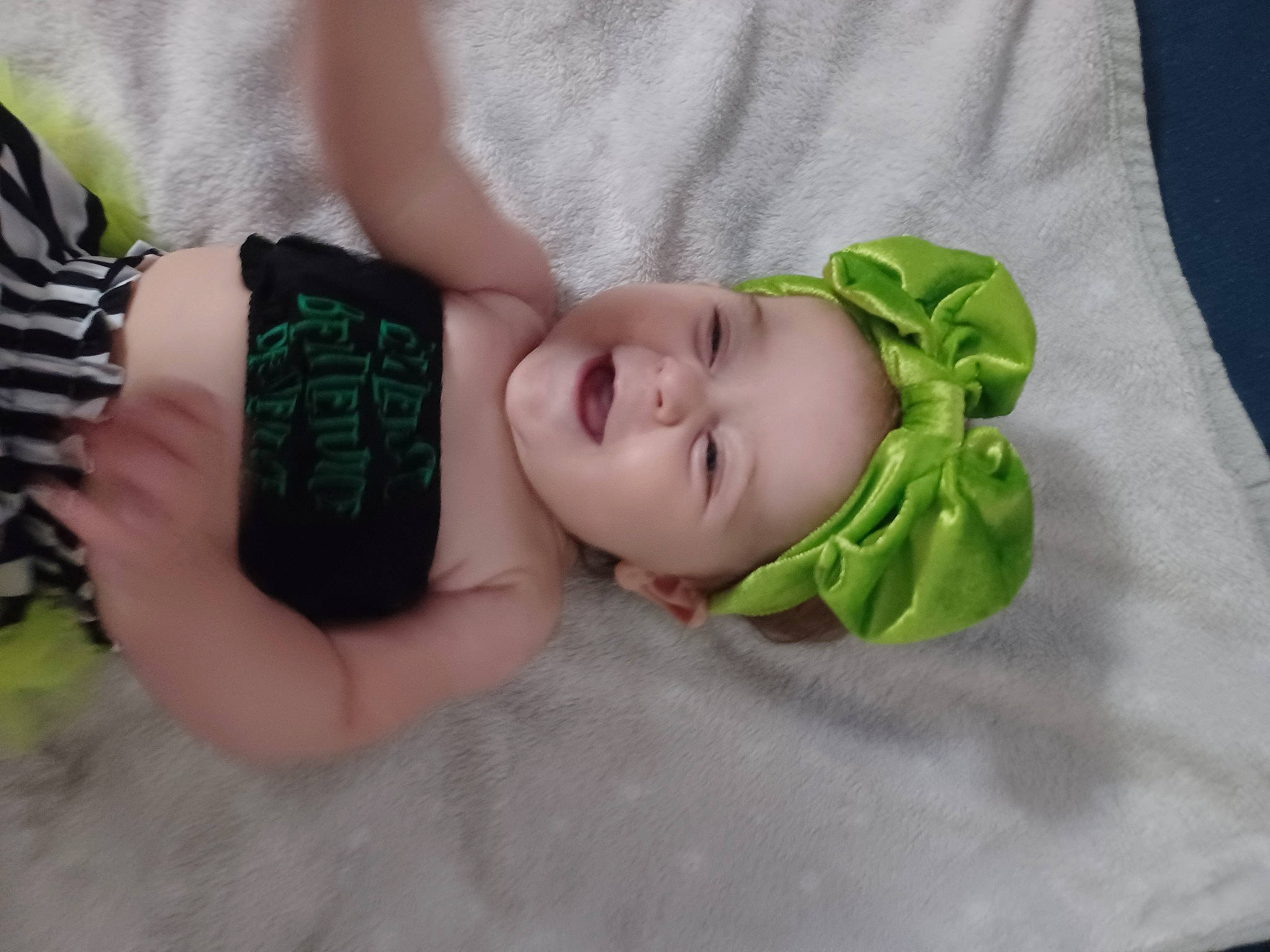Kaylynn is registered to the contest to win money with this photo: baby, baby_products, baby_toddler_clothing, comfort, eye, eyelash, finger, grass, hand, hat, head, headgear, headwear, human_body, neck, pattern, person, product, skin, sleeve