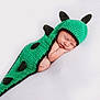 baby, newborn, sleeping, crochet, green, dinosaur_costume, spikes, cute, infant, soft, white_background, peaceful, portrait, resting, child, costume, knitted, adorable, toddler, face