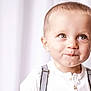 baby, child, toddler, portrait, closeup, smile, big_eyes, blond_hair, suspenders, white_shirt, soft_light, studio_background, cute, cheeks, innocent_expression, gaze, person, young, headshot, playful