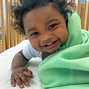 Prince joined the competition — help win amazing prizes! baby, blanket, child, close_up, crib, curly_hair, cute, face, green_blanket, hand, happy, indoors, person, portrait, skin, smile, teeth, toddler, white_clothing, wooden_crib