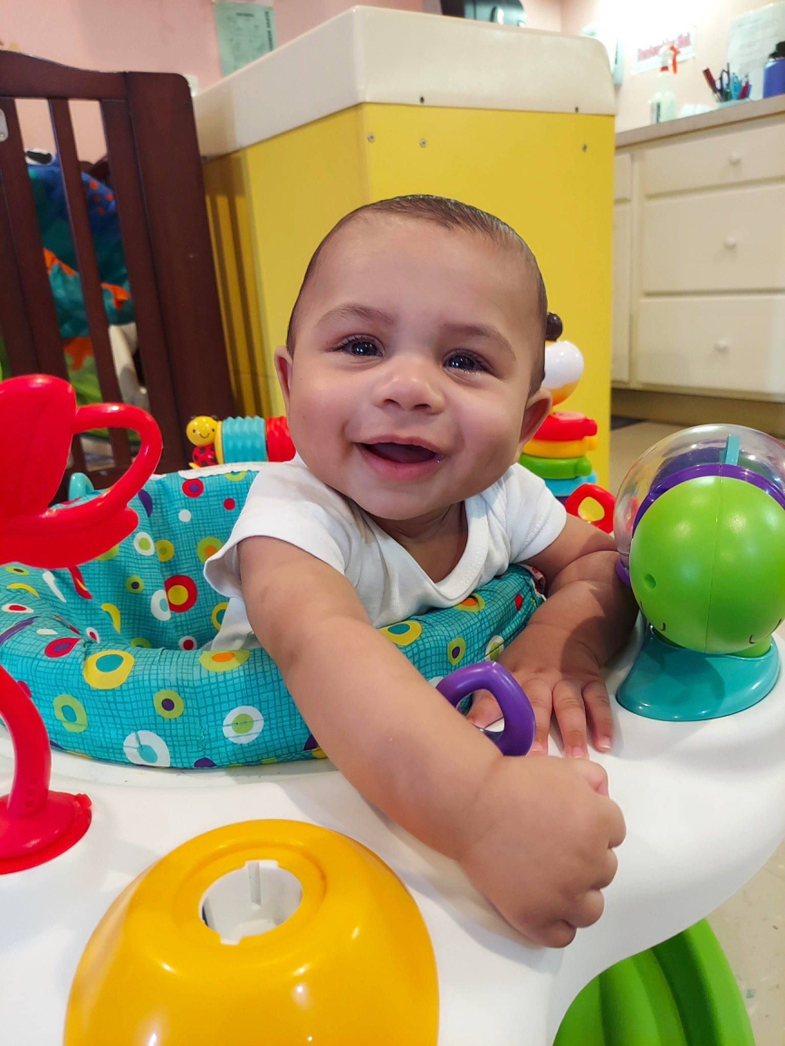 Jayceon is registered to the contest to win money with this photo: baby, baby_playing_with_toys, baby_toddler_clothing, baby_toys, cabinetry, child, event, facial_expression, fun, happy, joy, leisure, party, party_supply, people, person, plastic, play, product, smile