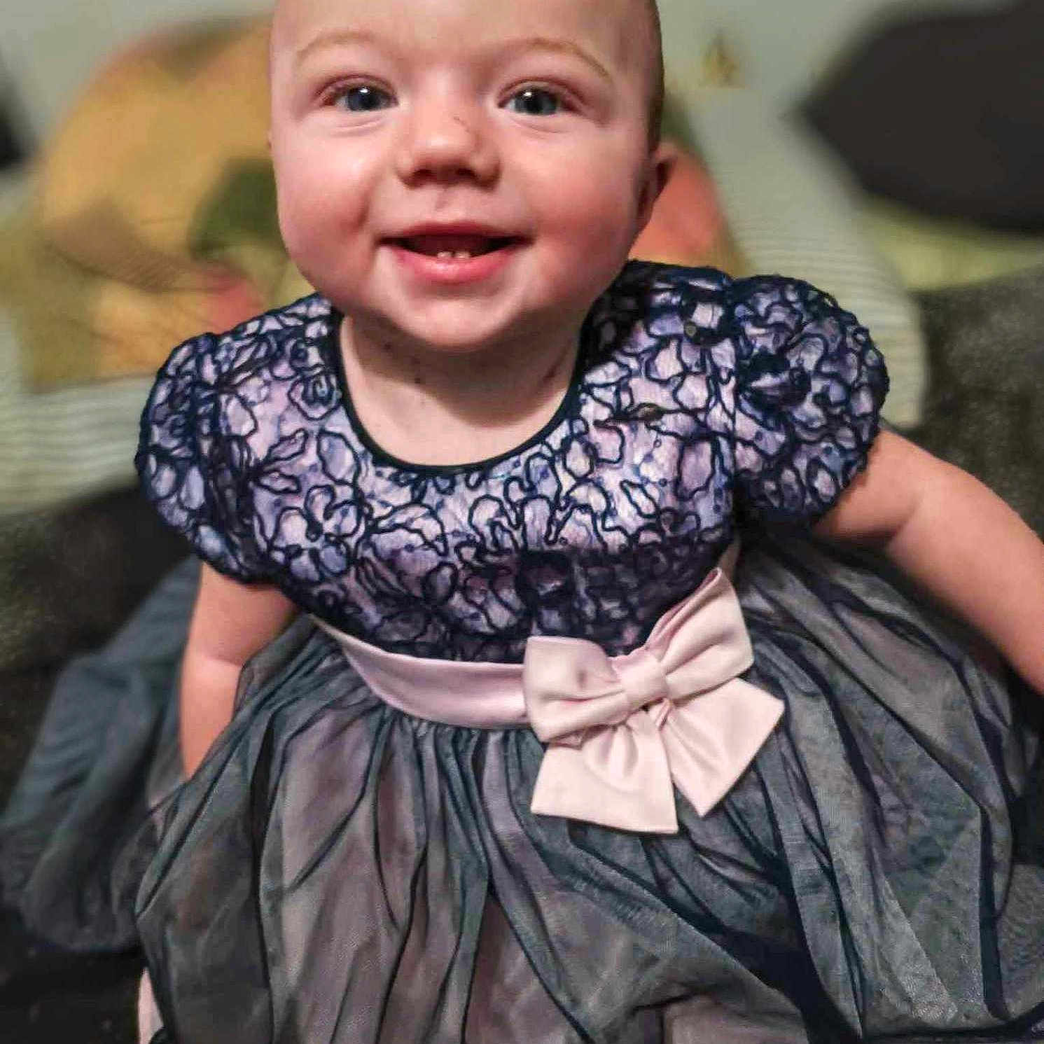 Peyton joined the competition — help win amazing prizes! accessories, baby, blouse, clothing, costume, dress, eveningdress, face, fashion, formalwear, gown, happy, head, jewelry, laughing, necklace, person, photography, portrait, smile