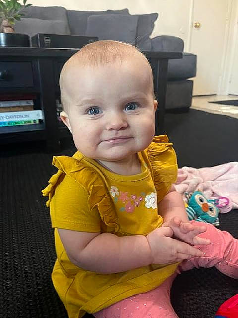 Scarlette joined the competition — help win amazing prizes! arm, baby, baby_products, baby_toddler_clothing, cheek, child, chin, eye, flooring, fun, hand, happy, head, human_body, iris, person, sitting, skin, sleeve, smile