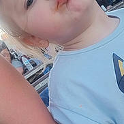 Scarlette joined the competition — help win amazing prizes! child, toddler, face, messy, blue_shirt, outdoor, pucker, expression, person, skin, hair, daylight, casual, people, adult_arm, portrait, cute, funny_face, young, clothing