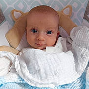Duncan joined the competition — help win amazing prizes! baby, blanket, blue, cozy, cute, face, infant, looking, pillow, portrait, resting, snug, soft, white, wrapped, young, child, head, eyes, indoors