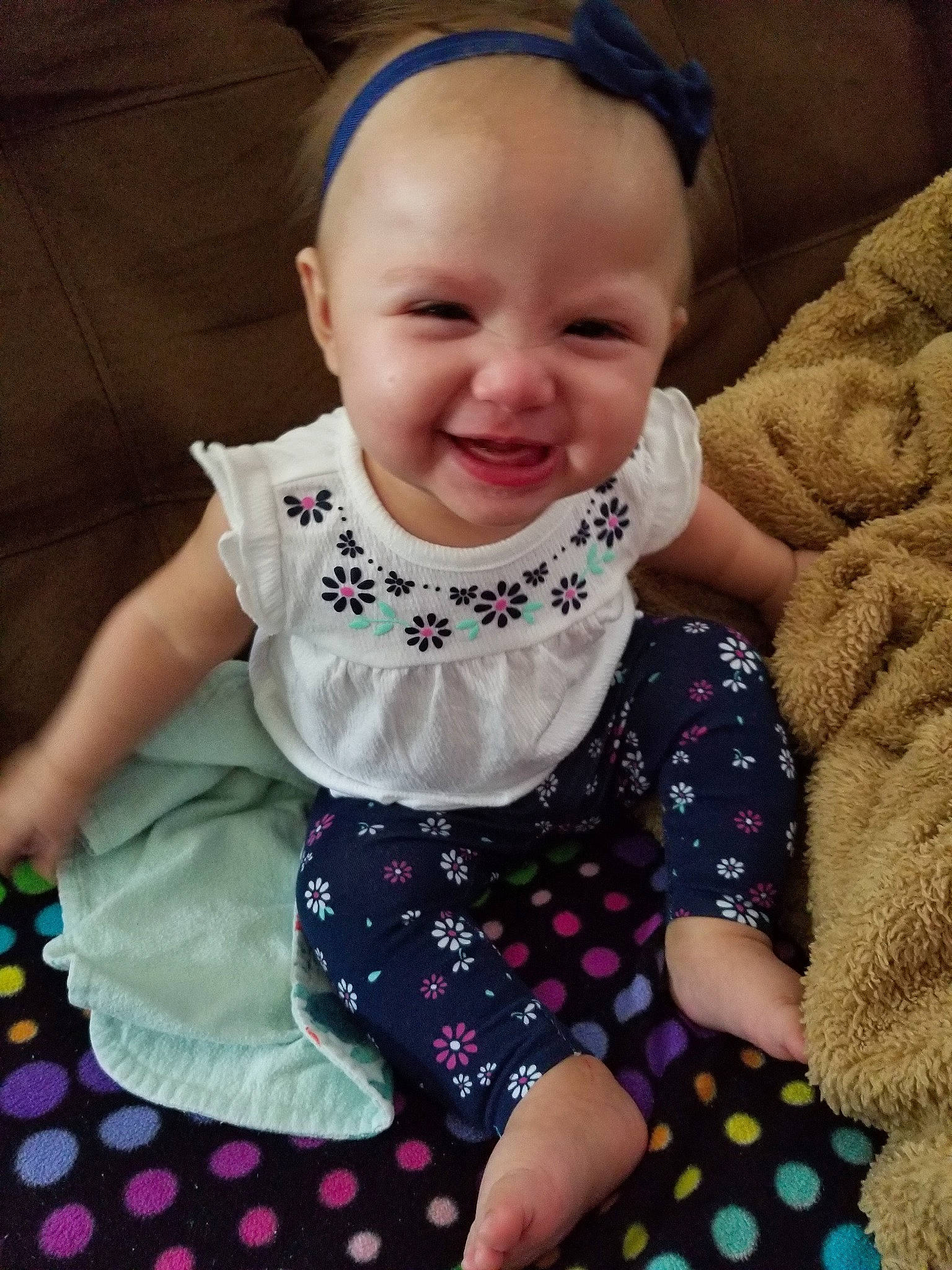 Julie is registered to the contest to win money with this photo: baby, baby_products, baby_toddler_clothing, cheek, child, design, dress, face, head, joy, pattern, person, pink, polka_dot, product, skin, sleeve, smile, textile, toddler