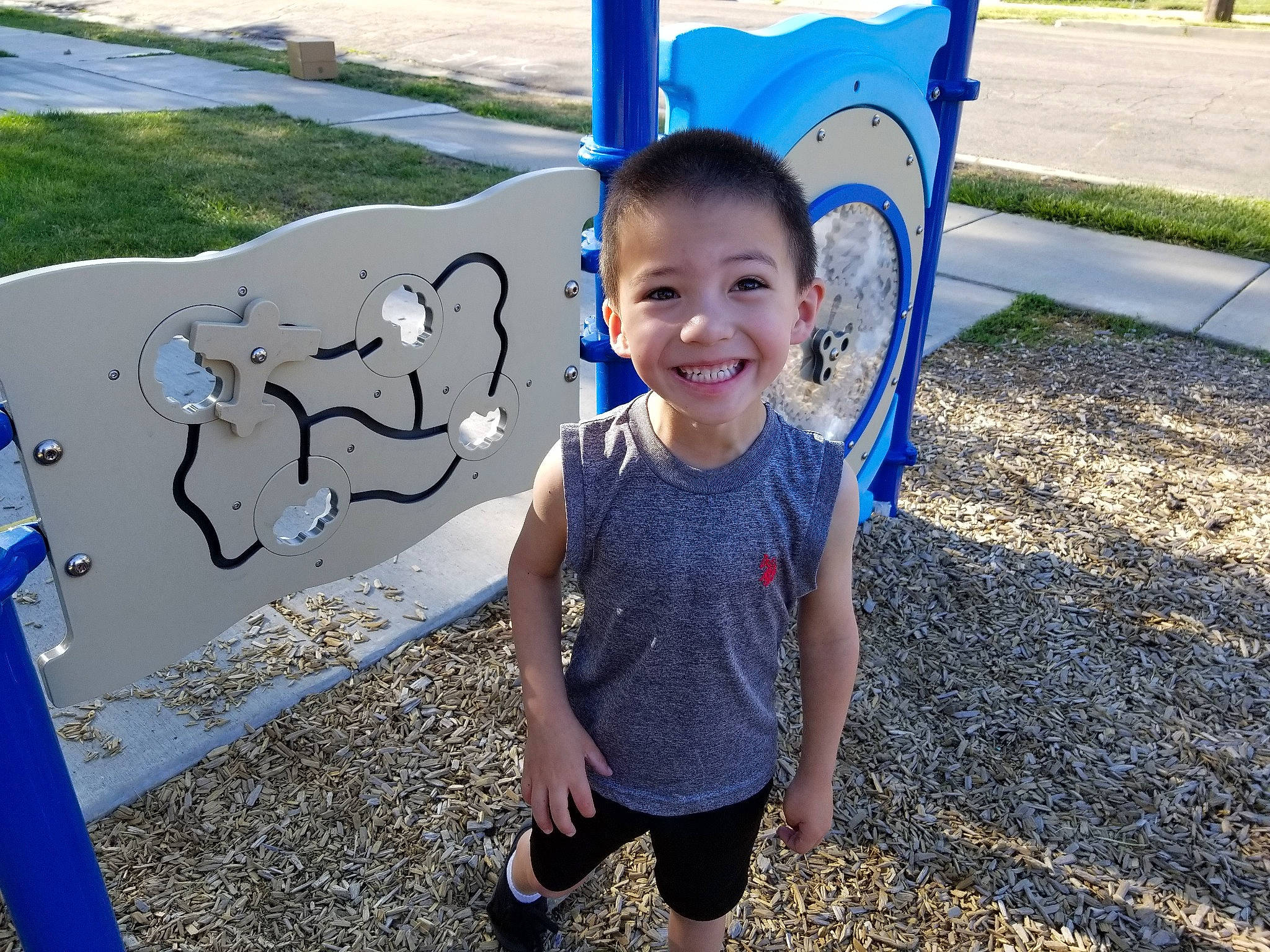 Carmeno is registered to the contest to win money with this photo: child, city, cool, fun, happy, human_settlement, joy, leisure, outdoor_play_equipment, person, plant, play, playground, public_space, recreation, smile, summer, t_shirt, toddler, tree