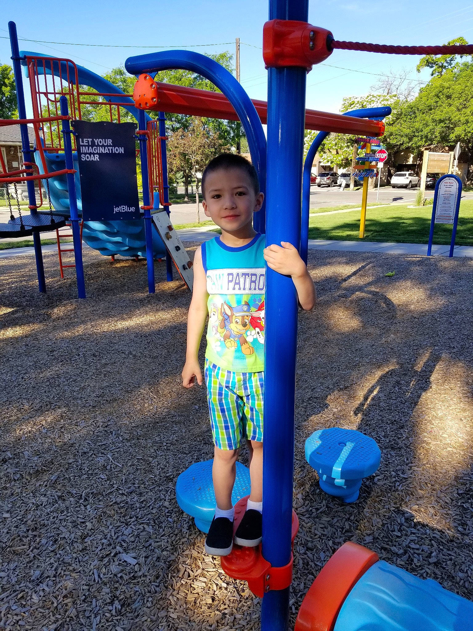 Carmeno is registered to the contest to win money with this photo: amusement_park, child, chute, city, fun, human_settlement, leisure, nonbuilding_structure, outdoor_play_equipment, park, person, play, playground, public_space, recreation, smile, summer, toddler, vacation