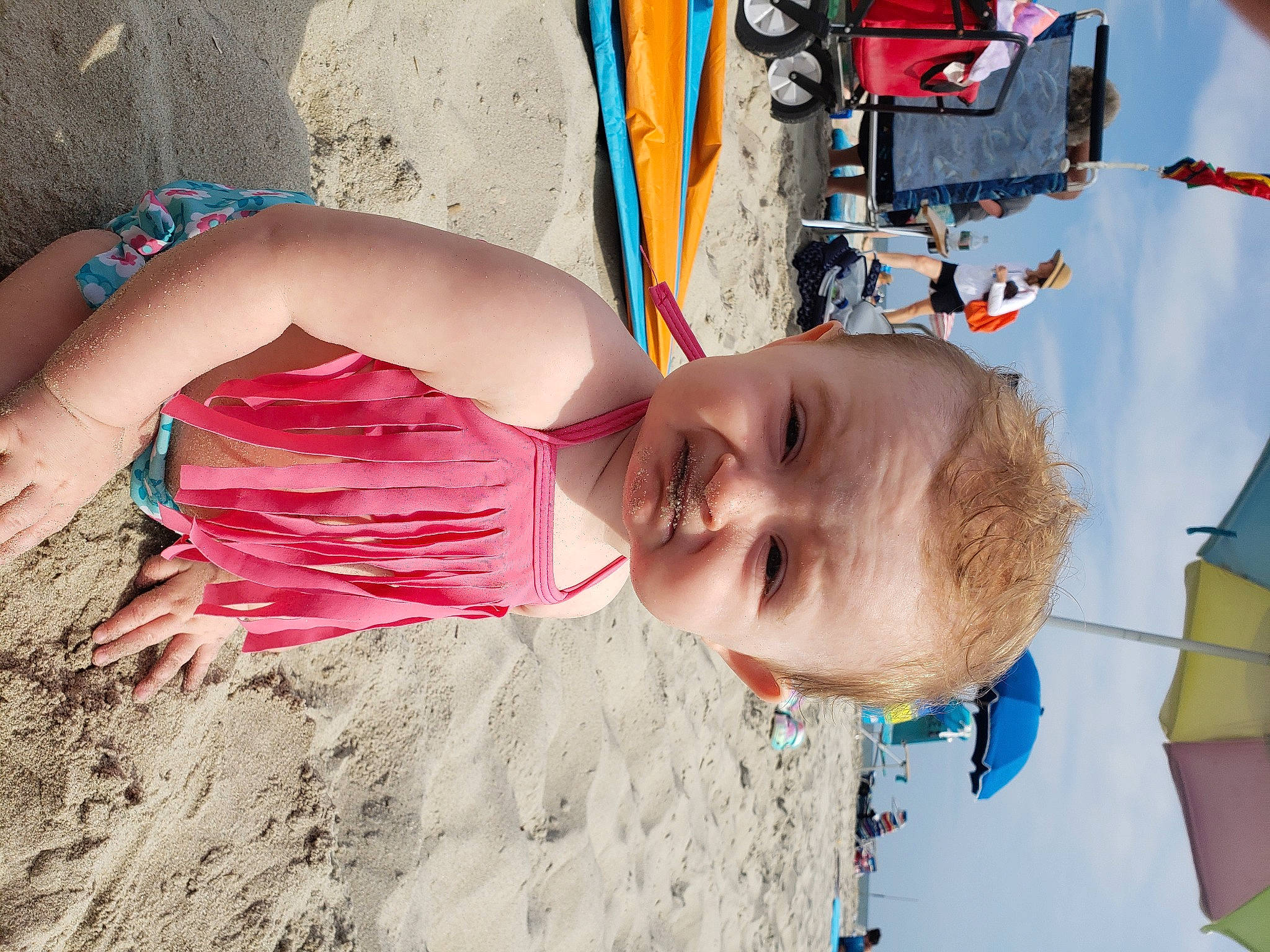 Vaeda is registered to the contest to win money with this photo: beach, blue, body_of_water, child, fun, happy, hat, leisure, people_in_nature, people_on_beach, person, play, sand, smile, summer, swimwear, textile, thigh, toddler, travel