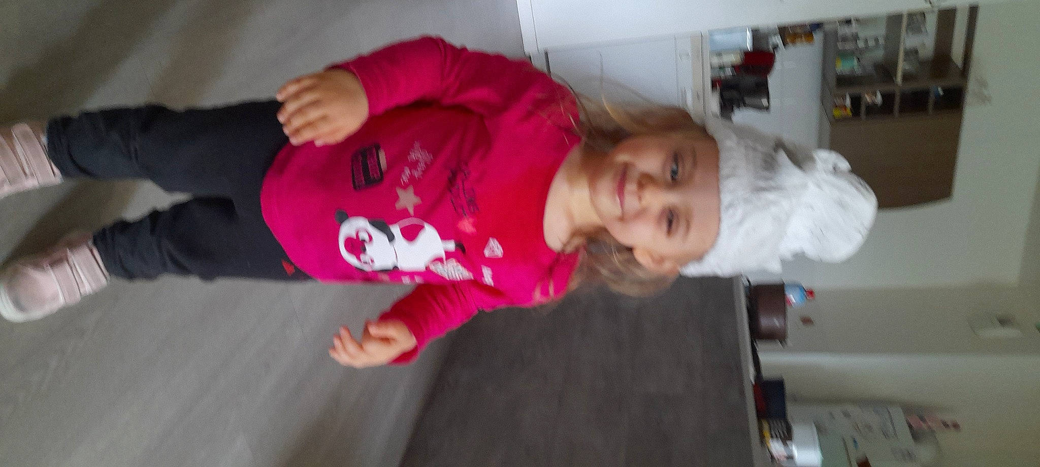 Sophia a rejoint le concours — aidez-le/la à gagner de superbes lots ! baby, baby_toddler_clothing, cheek, child, event, flooring, fun, fur, hat, headwear, hoodie, joy, magenta, person, room, sitting, sleeve, smile, toddler