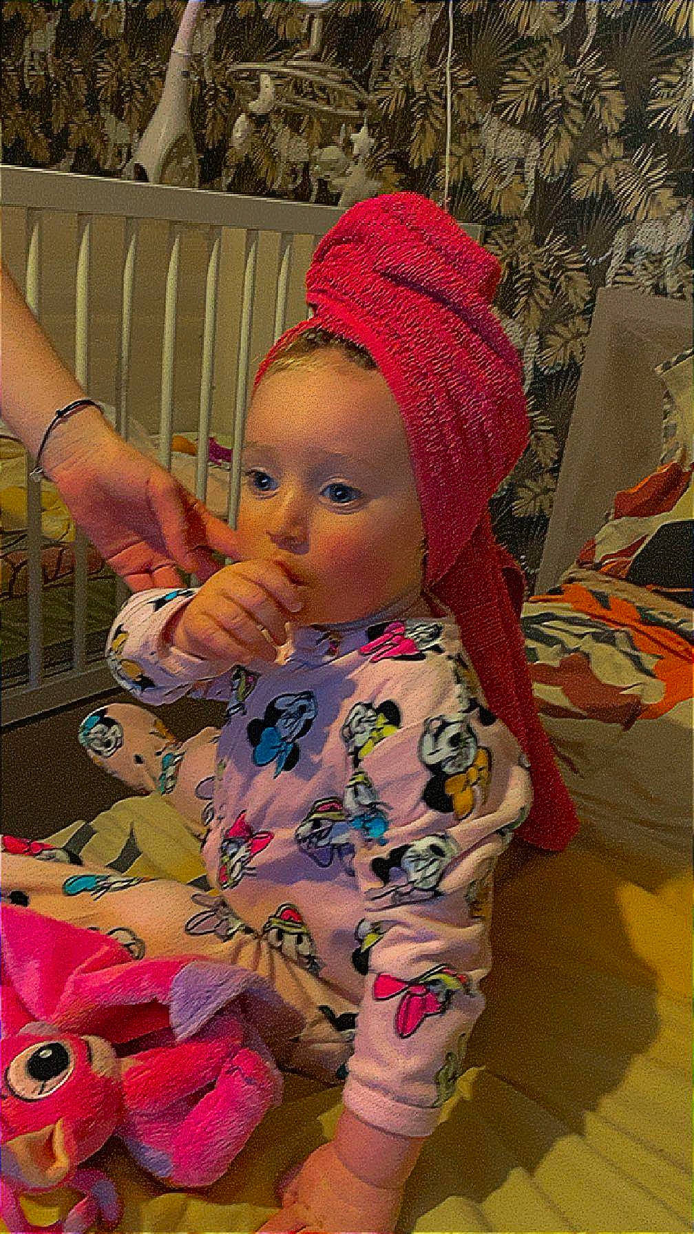 Mackenzie participe au concours pour gagner de l'argent avec cette photo : art, baby, baby_toddler_clothing, beanie, cap, cheek, child, doll, fashion_accessory, fence, fun, knit_cap, magenta, pattern, person, pink, sitting, skin, stuffed_toy, toddler