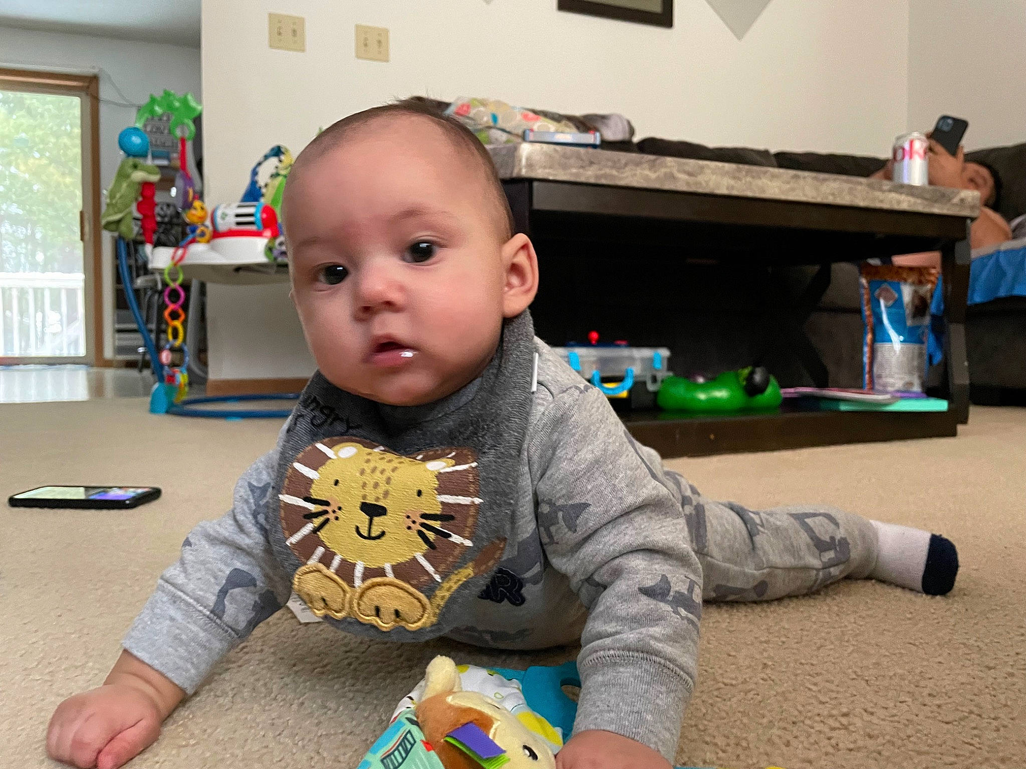 Mateo is registered to the contest to win money with this photo: baby, baby_playing_with_toys, baby_toddler_clothing, baby_toys, blue, bookcase, chair, child, flooring, fun, hardwood, learning, person, picture_frame, play, room, shelf, sitting, t_shirt, toddler