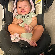 Enzley joined the competition — help win amazing prizes! baby, infant, car_seat, smiling, child, onesie, blanket, indoors, cute, happy, foot, hand, face, person, seatbelt, clothing, toddler, child_safety, expression, sitting