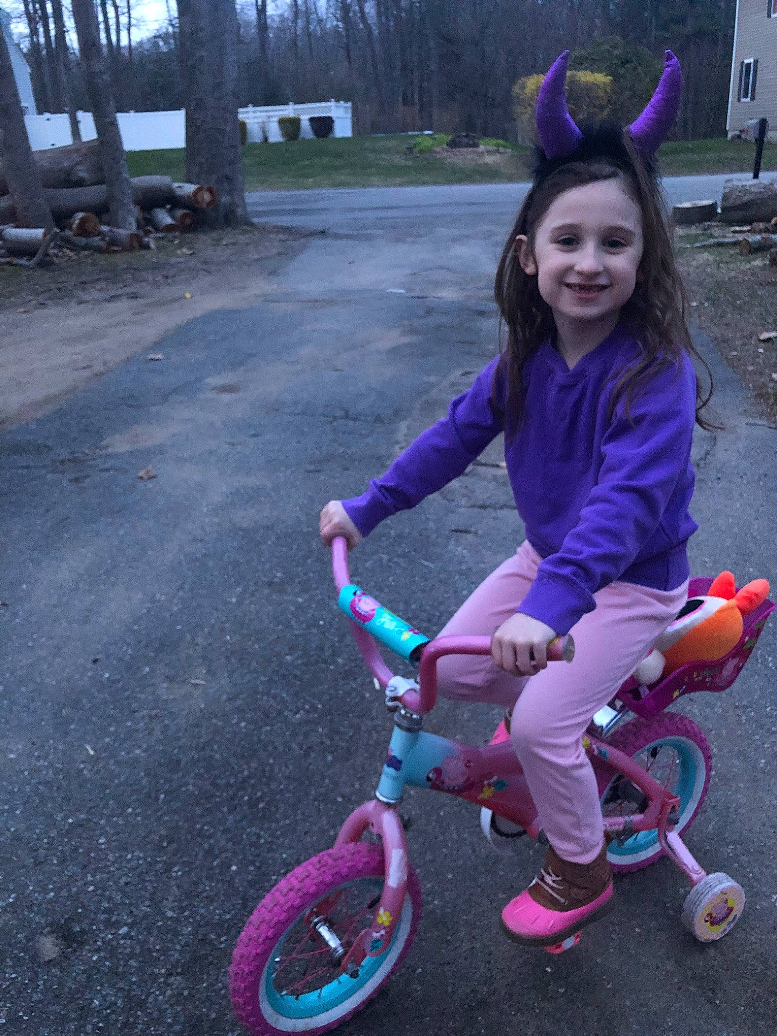 Marceline is registered to the contest to win money with this photo: bicycle, bicycle_accessory, bicycle_wheel, child, cycling, joy, person, pink, purple, recreation, spoke, sports_equipment, training_wheels, tricycle, vehicle, wheel