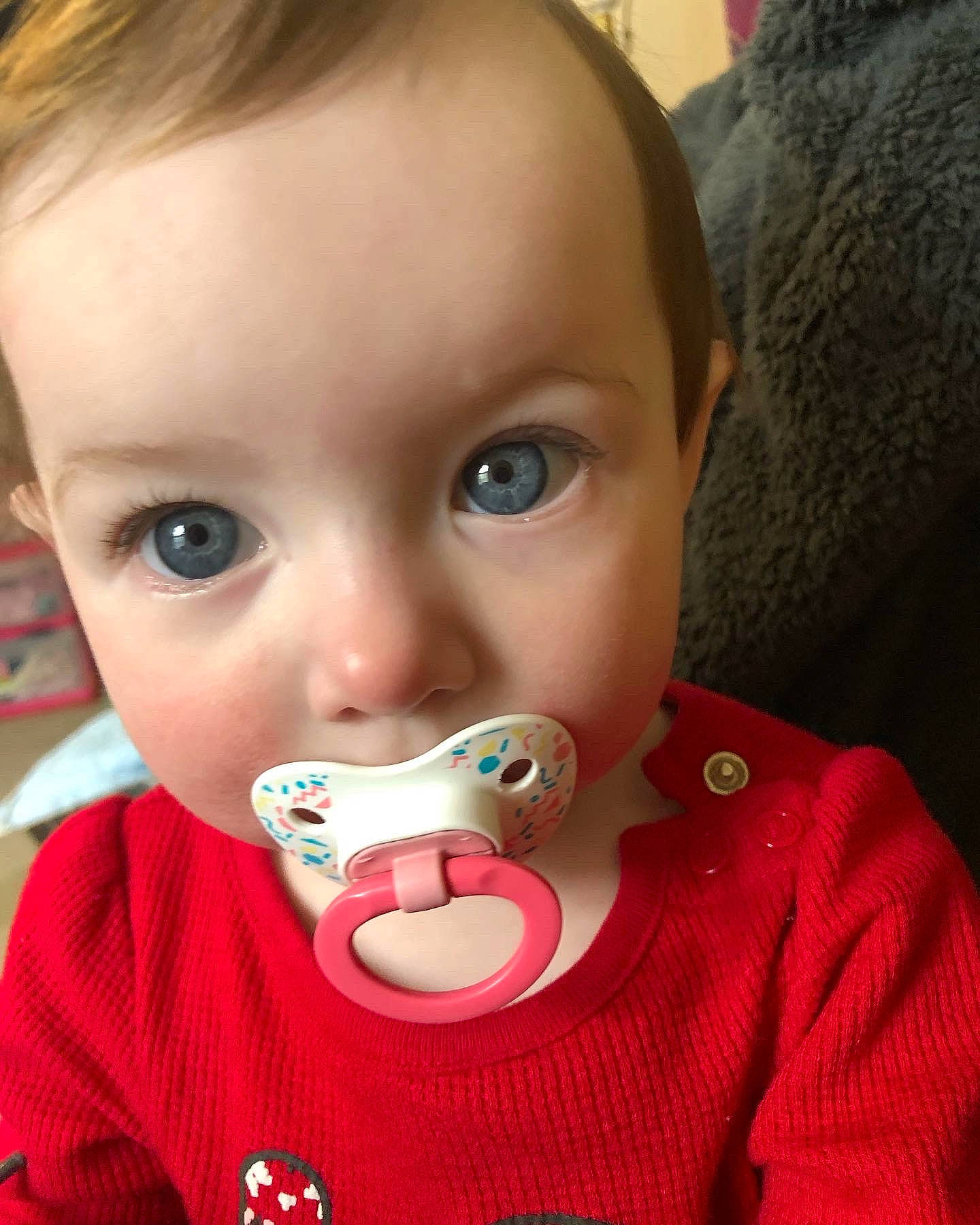 Leah is registered to the contest to win money with this photo: baby, baby_toddler_clothing, bib, cheek, child, chin, curious, drinkware, ear, eyebrow, eyelash, fun, happy, iris, lip, mouth, nose, person, skin, sleeve
