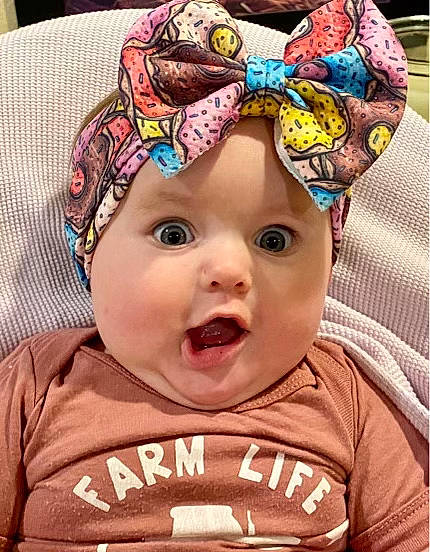Blair is registered to the contest to win money with this photo: baby, baby_toddler_clothing, blue, cap, cheek, cool, eye, eyebrow, forehead, happy, head, headgear, headwear, human, human_body, iris, mouth, nose, organ, person