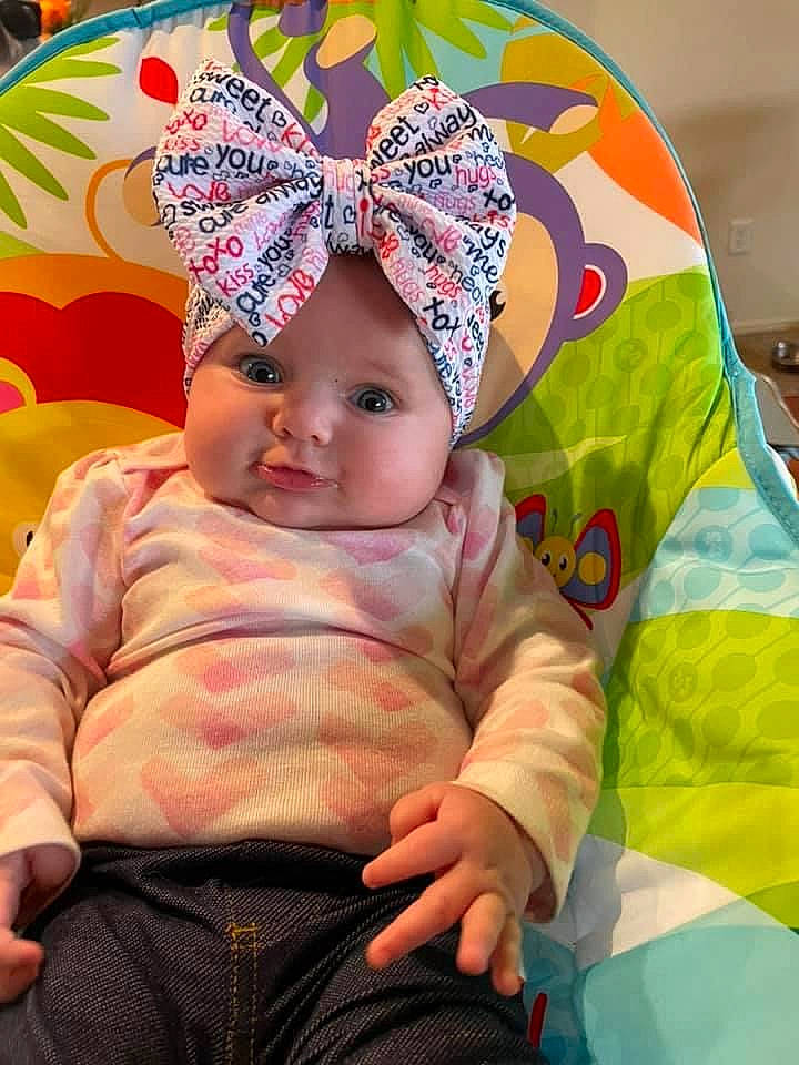 Blair is registered to the contest to win money with this photo: baby, baby_products, baby_sleeping, baby_toddler_clothing, beanie, cap, cheek, child, comfort, face, fun, happy, head, headwear, knit_cap, linens, magenta, person, pink, play