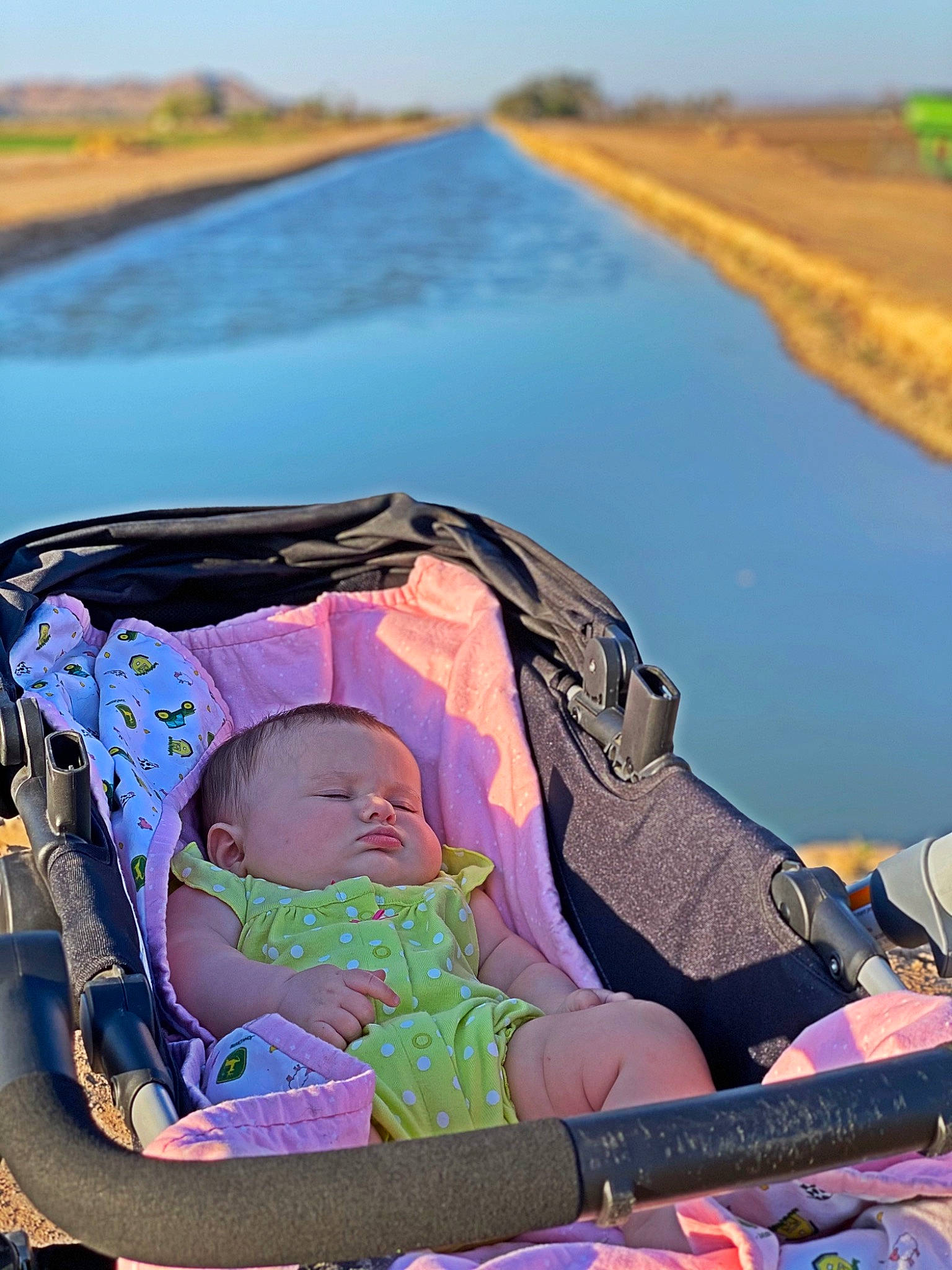 Blair joined the competition — help win amazing prizes! baby, baby_carriage, baby_products, body_of_water, camping, comfort, grass, grassland, lake, landscape, lap, leisure, morning, person, plant, recreation, sky, summer, toddler, travel