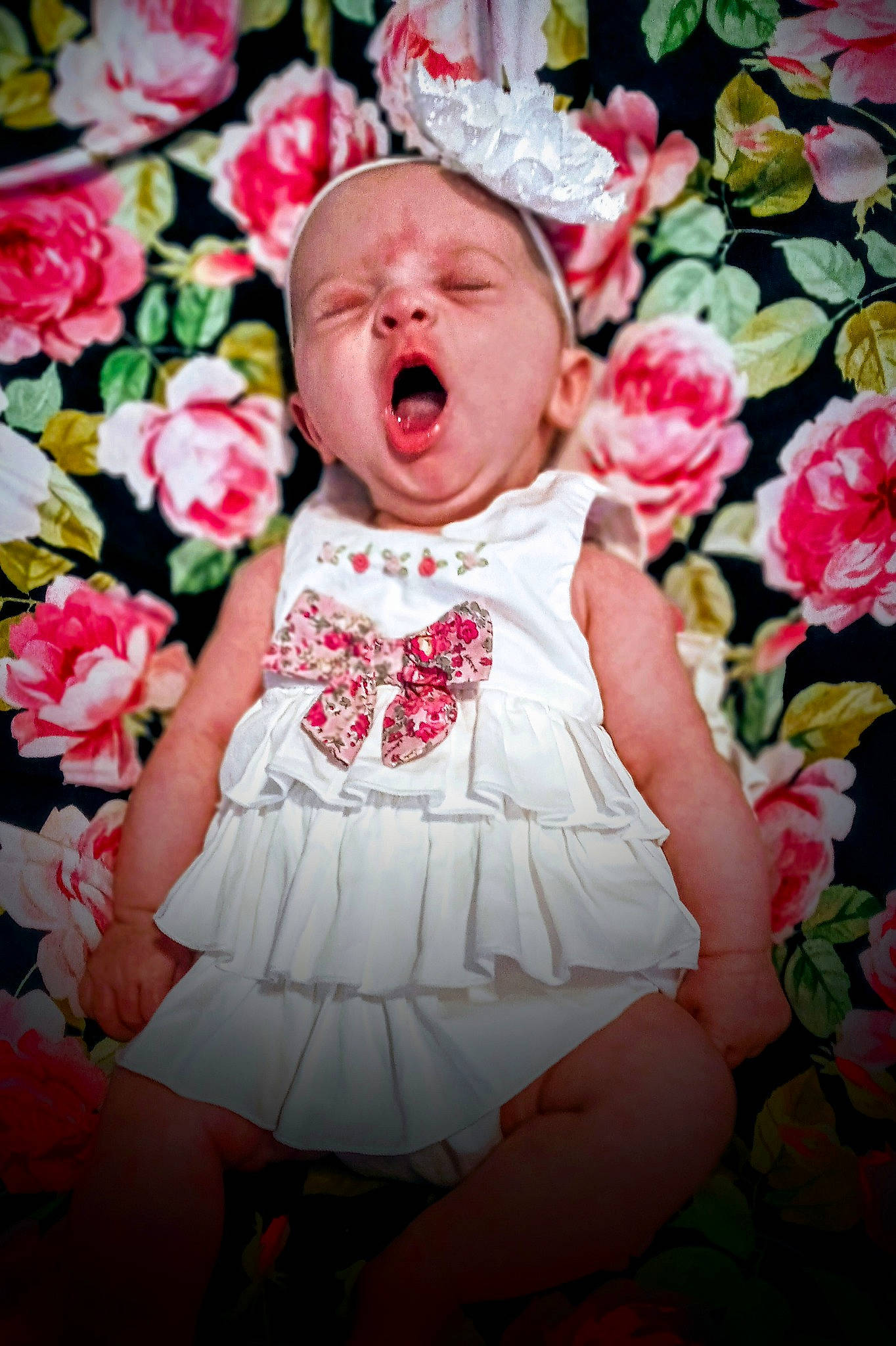 Jillian is registered to the contest to win money with this photo: baby, baby_laughing, baby_toddler_clothing, cheek, child, dress, facial_expression, fashion_accessory, flower, hair_accessory, happy, headgear, person, petal, photography, pink, plant, red, rose, smile