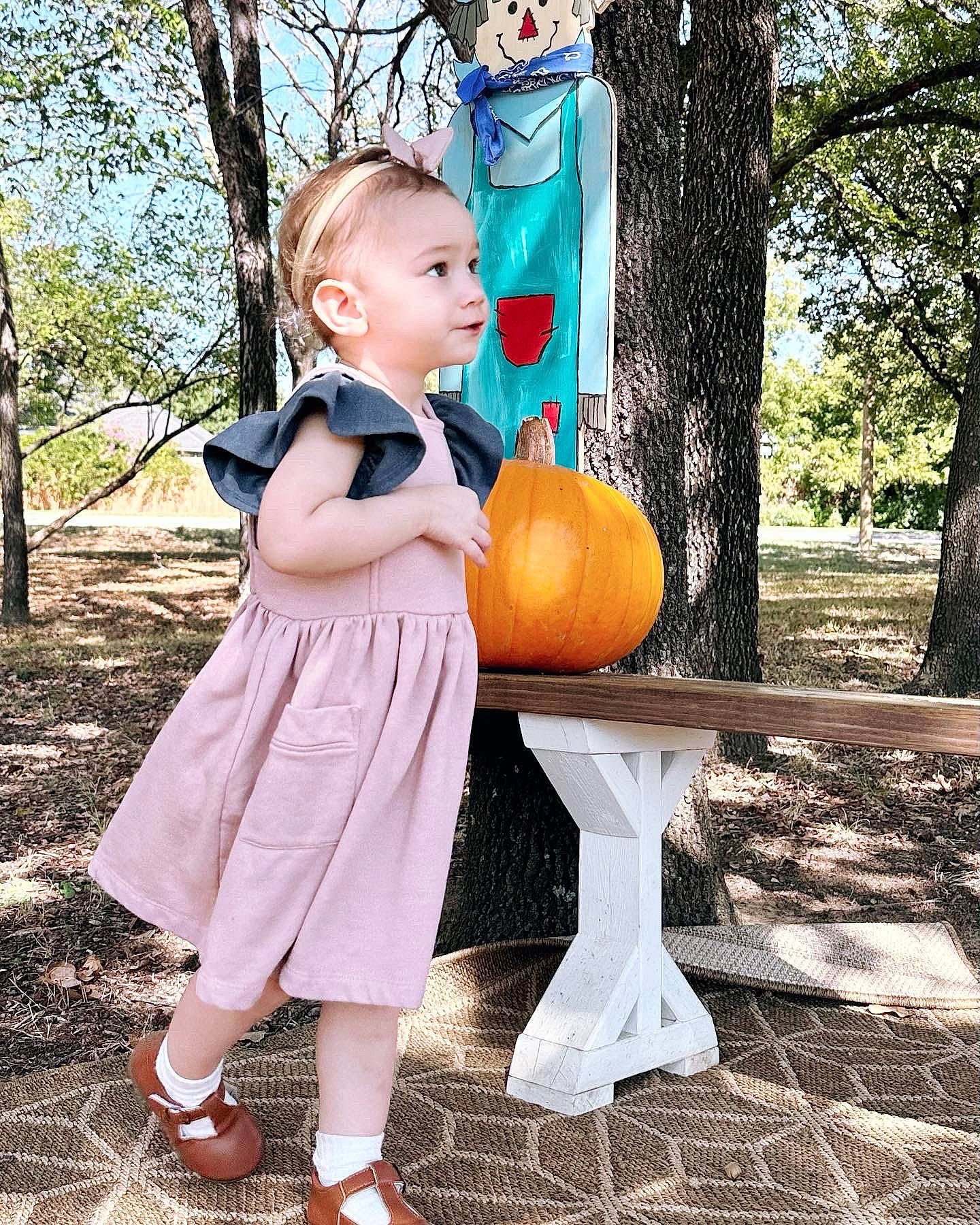 Kayleigh is registered to the contest to win money with this photo: baby_toddler_clothing, blond, calabaza, child, fawn, fun, gourd, grass, happy, knee, leisure, people_in_nature, person, plant, play, pumpkin, recreation, sitting, toddler, tree