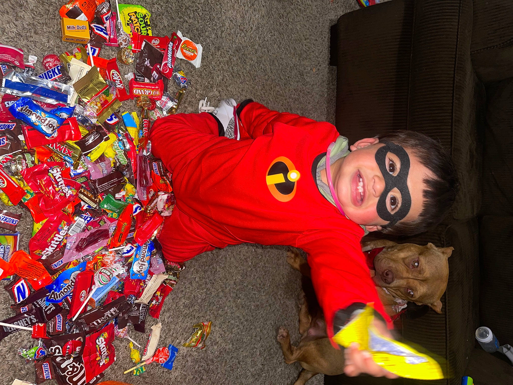 Angel is registered to the contest to win money with this photo: carmine, child, costume, electric_blue, event, fictional_character, fun, hat, person, personal_protective_equipment, plastic, plastic_bag, room, smile, toddler