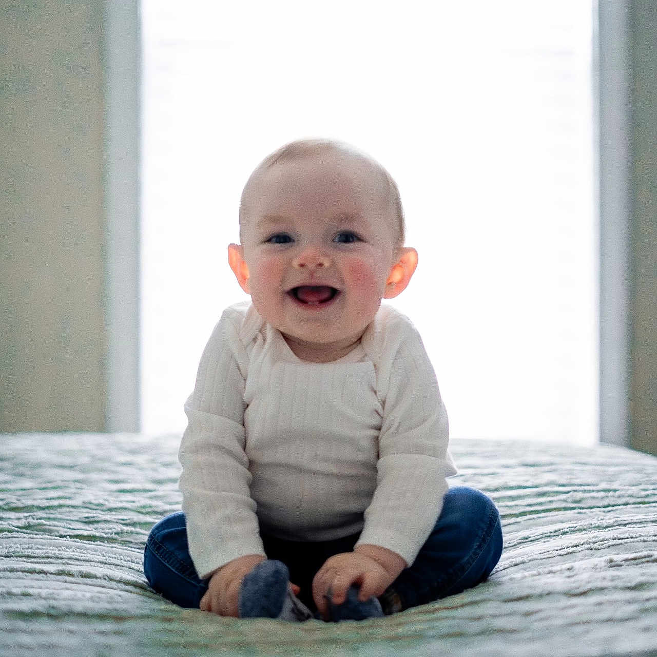 Liam joined the competition — help win amazing prizes! baby, babycrawling, babylaughing, bed, bedroom, bodypart, clothing, crawling, face, finger, furniture, hand, happy, head, indoors, jeans, laughing, longsleeve, mouth, newborn