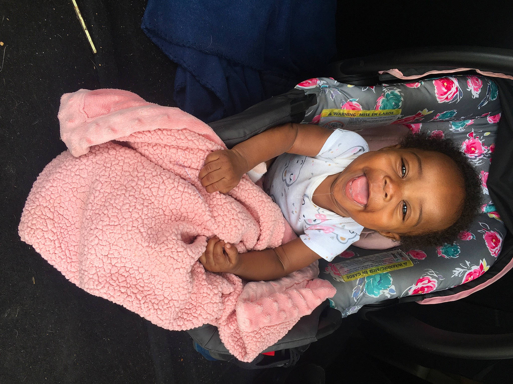 Hazel is registered to the contest to win money with this photo: baby, baby_products, baby_toddler_clothing, cheek, child, comfort, finger, fun, gesture, happy, head, lap, mouth, nose, person, skin, sleeve, smile, thumb, toddler