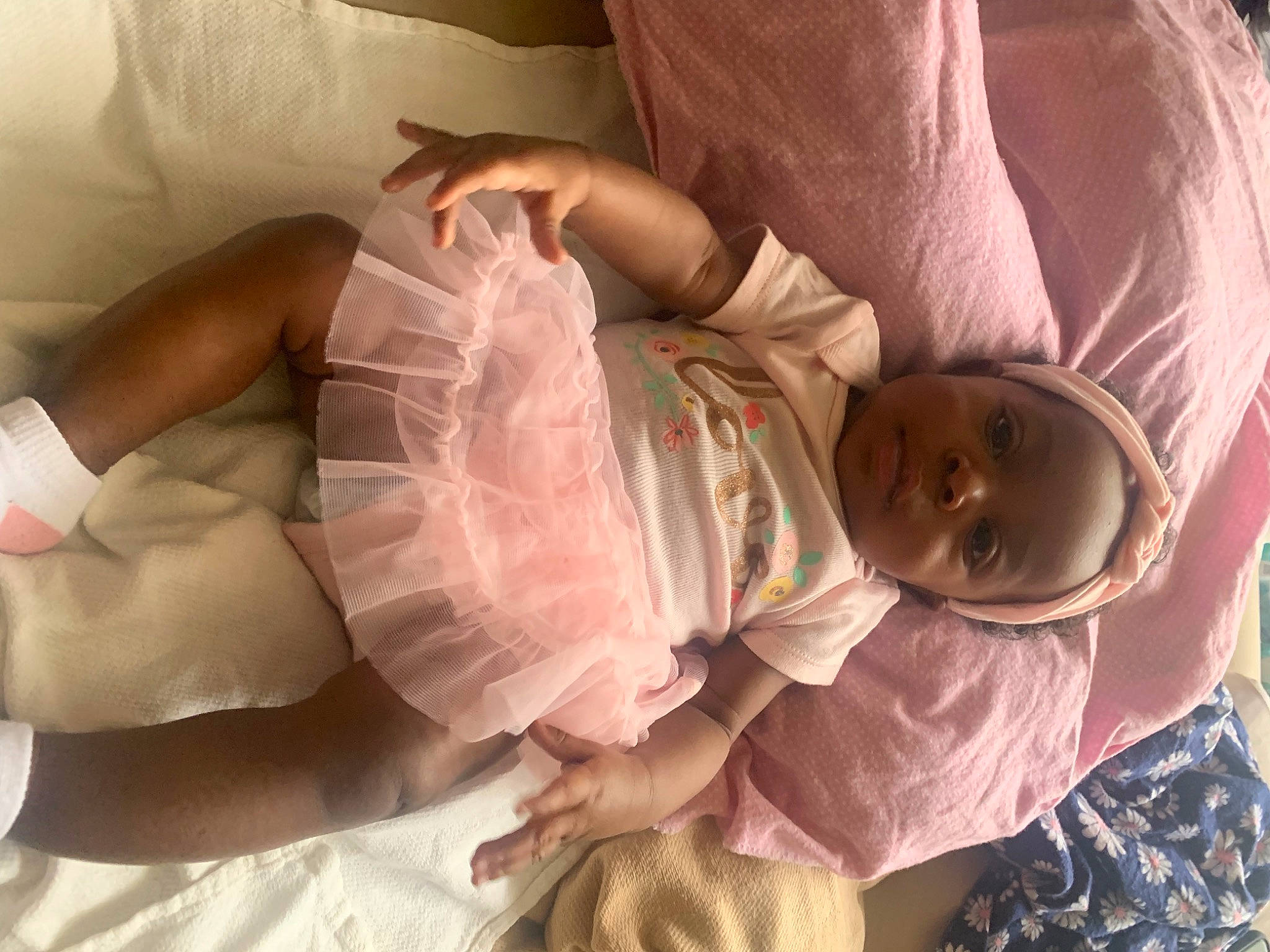 Hazel is registered to the contest to win money with this photo: abdomen, arm, baby, baby_toddler_clothing, cheek, chest, child, comfort, face, finger, head, human_body, mouth, nail, person, pink, skin, sleeve, textile, thumb