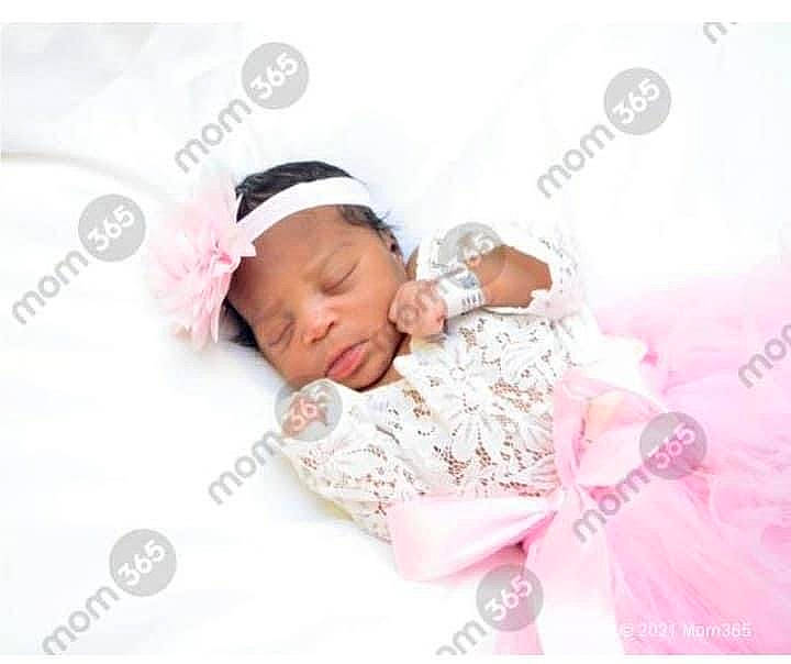 Hazel is registered to the contest to win money with this photo: baby, baby_products, baby_sleeping, baby_toddler_clothing, child, comfort, fashion_accessory, font, happy, headband, headpiece, headwear, knit_cap, linens, magenta, pattern, peach, person, petal, pink