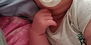 Hudson joined the competition — help win amazing prizes! baby, infant, pacifier, bed, blanket, cartoon_clothing, sleepy, child, hand, cute, indoors, portrait, soft, pink_blanket, white_shirt, comfort, person, toddler, resting, young