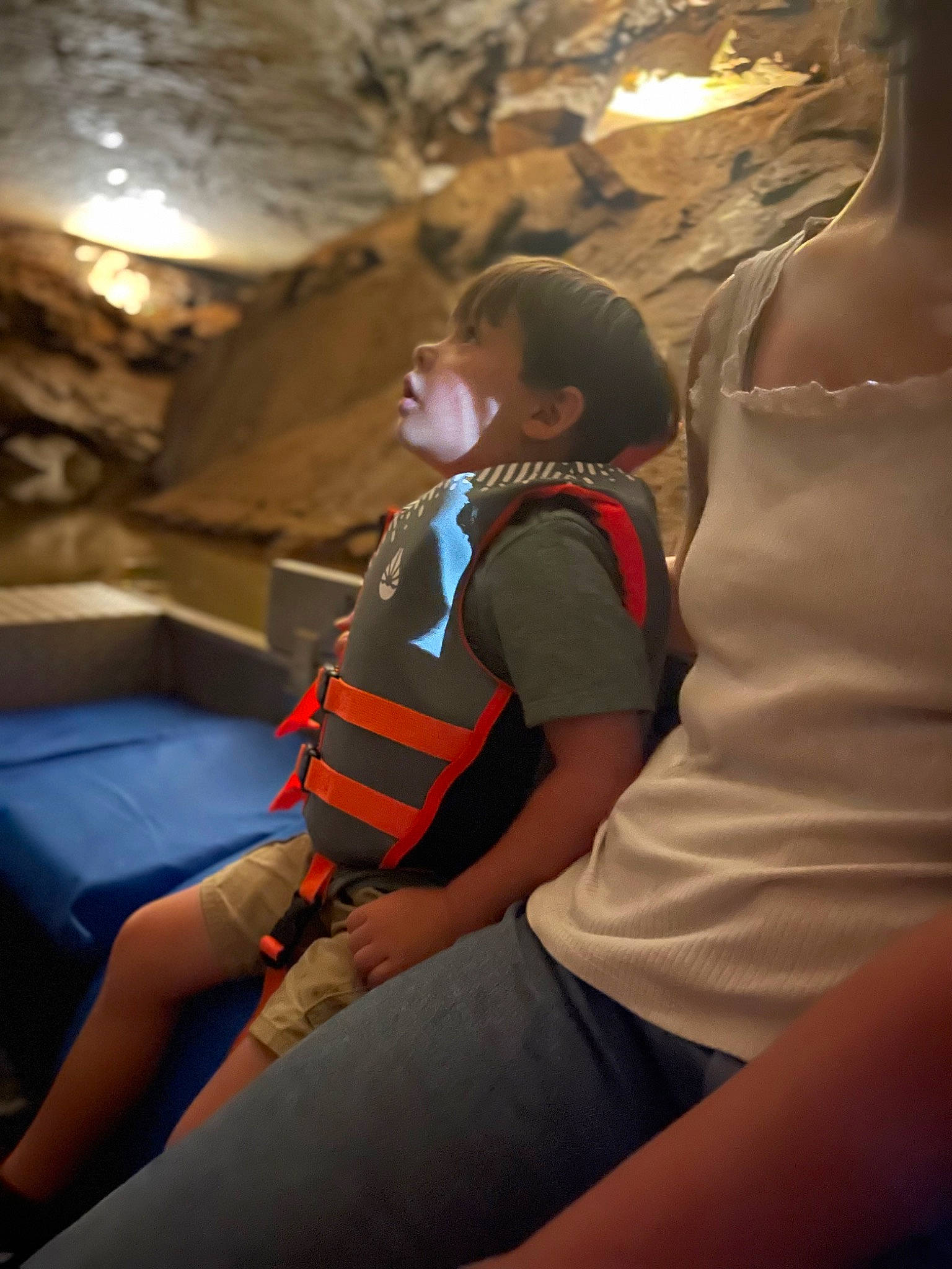 August is registered to the contest to win money with this photo: air_travel, backpack, bag, comfort, event, flash_photography, fun, human_leg, knee, lap, leisure, luggage_and_bags, person, recreation, room, shorts, sitting, t_shirt, thigh, tourism