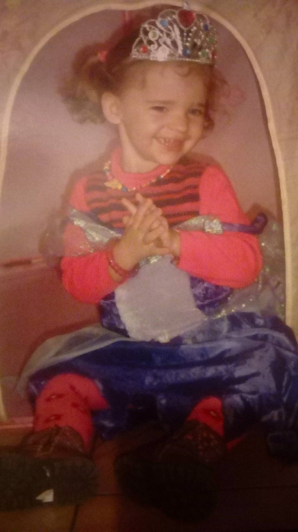 Lily Rose participe au concours pour gagner de l'argent avec cette photo : baby, baby_toddler_clothing, cap, child, comfort, finger, hair_accessory, headband, headpiece, human_body, joy, lap, person, sitting, sock, thumb, tiara, toddler, vintage_clothing